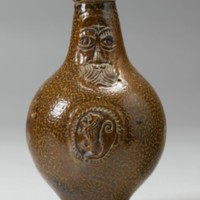 Here we have an intact Bellarmine vessel. Note the pear like shape and grotesque, not-quite-human face characteristic of later Bellarmines, crafted with less care and individual attention to meet high demand.