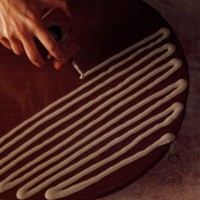 White slip is trailed onto a dish in this example of the trailing technique.