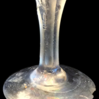 Facet-Cut Stem Design with a Hexagonal Fluted Stem (1760 to 1810)<br />
<br />
In Maryland, archeologists uncovered a colorless stemmed glass with a hexagonal fluted stem, very similar to our fragment. Both pieces have a facet-cut stem design and date from 1760 to 1810.