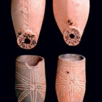 A series of red clay pipe bowls from the Chesapeake region of Virginia.