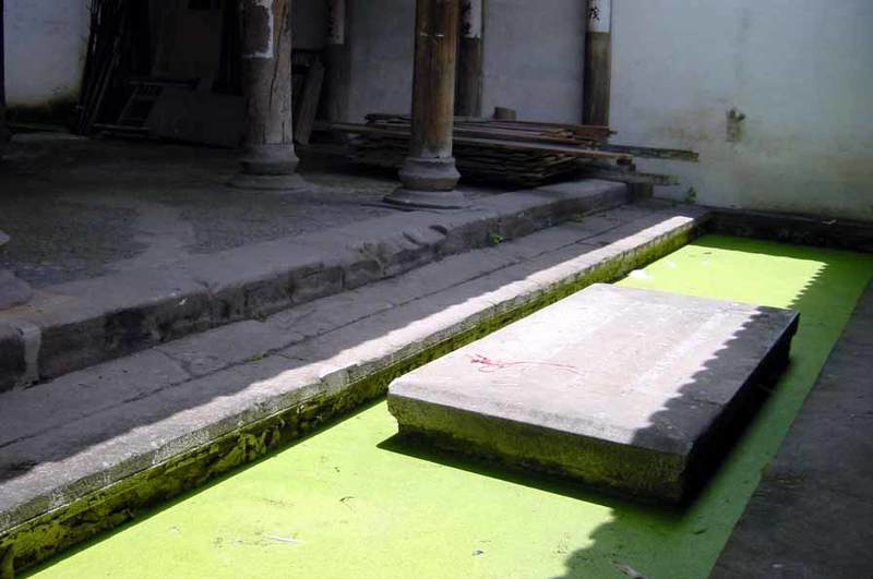 `Sky Well` (small courtyard) at the entrance with a ditch through the building