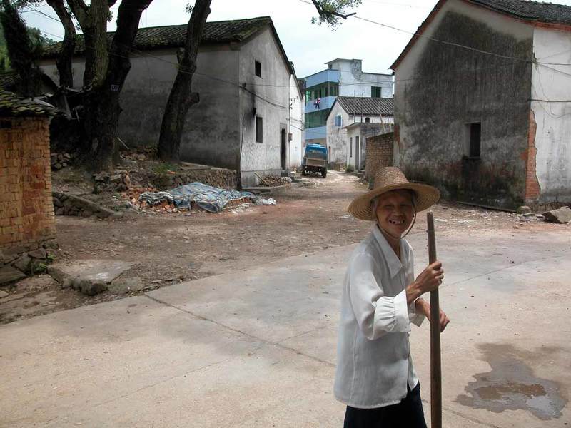 A woman walking with a stick A woman walking with a stick