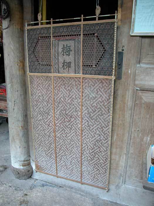 Bamboo door screen on the right-hand side of the hall