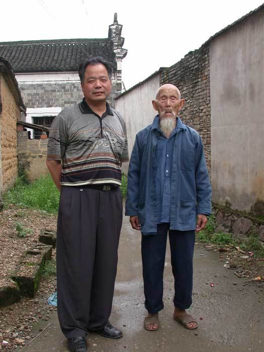 Oldest man in the village (97) with village official Oldest man in the village (97) with village official