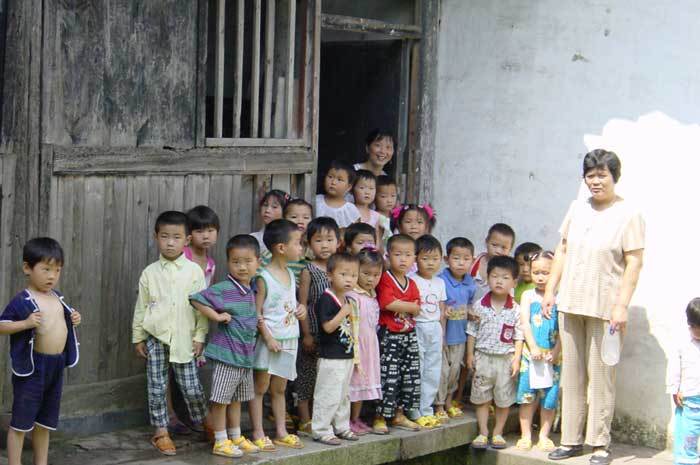 Kids in front of the nursery school locating in the right gallery