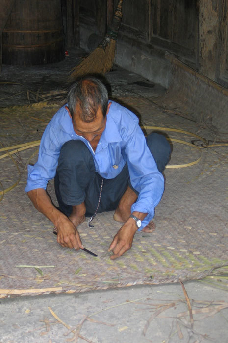 man weaving mat2