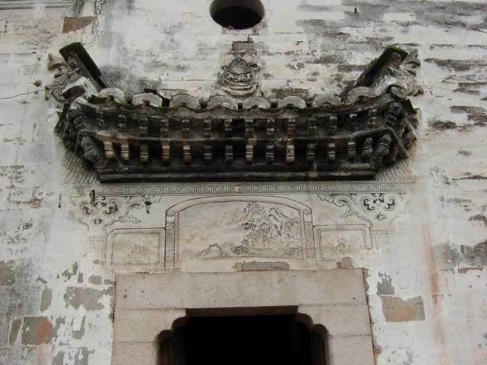Top of a side gate with a landscape painting