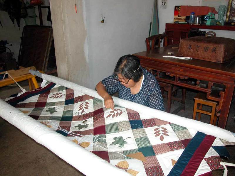 A villager quilting A villager quilting