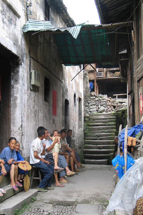 gathering under green awning