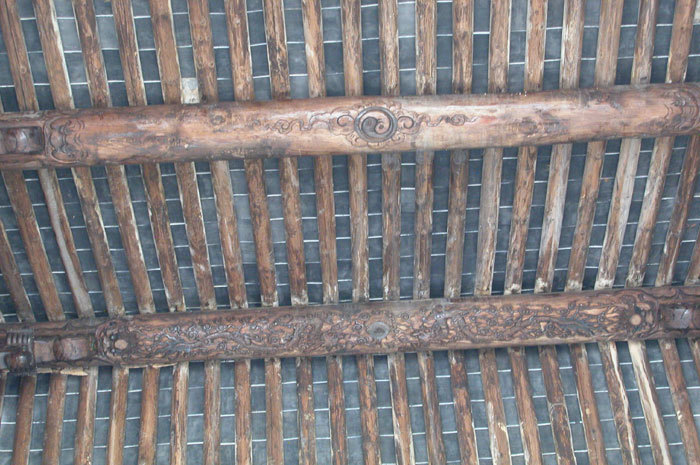 Yin and Yang symbols on the central roof beam Yin and Yang symbols on the central roof beam