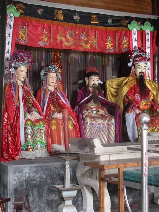 City God parents in the middle accompanied by City God and his wife