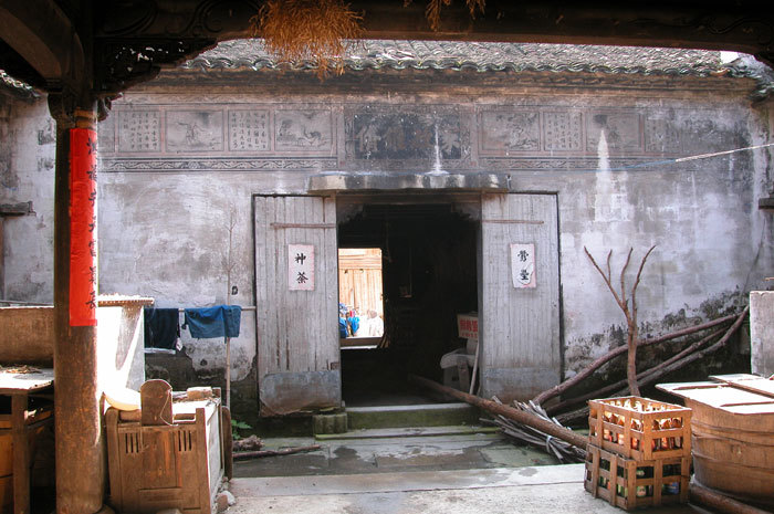 painting on wall above door, second side courtyard