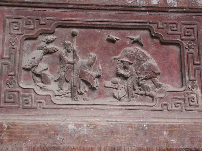 Small carved relief panels of filial piety themes on back wall of back court