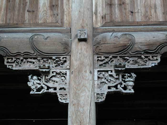 Carved bracket of the 2nd pillar on the left-hand side