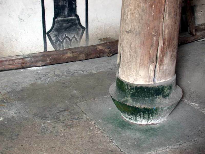 Pillar base & wall painting Northwest corner--stone pillar base & wall painting of same base