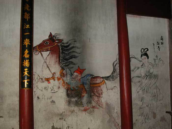 A horse painted on the left-hand side wall of the hall