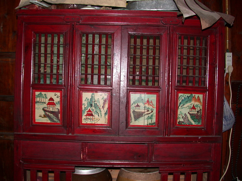 Cupboard with 4 small painted panels Cupboard with 4 small painted panels