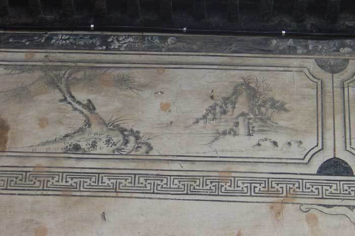 Painting on the left-hand side of the wall.pine trees