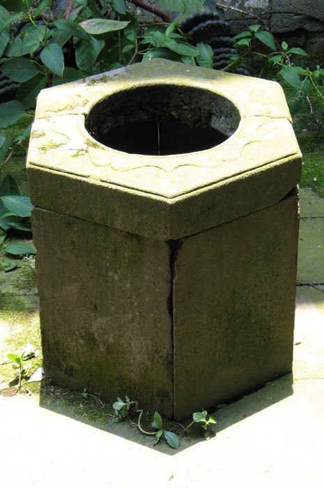 Well on the right-hand side of the courtyard