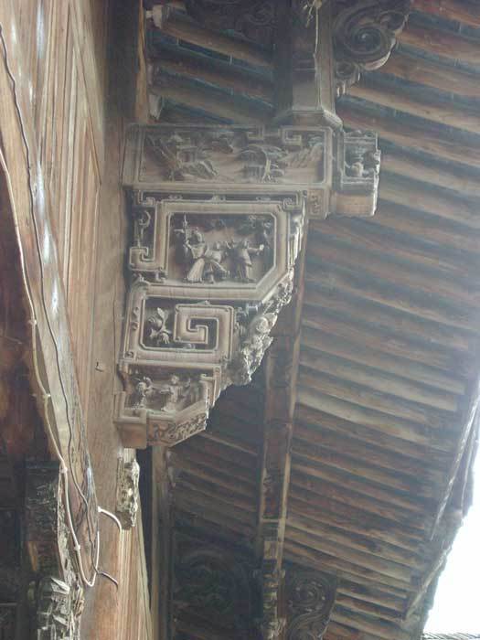 Carved bracket with domestic themes