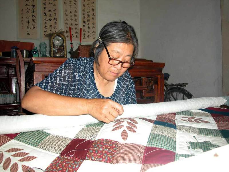 A villager quilting-1 A villager quilting-1