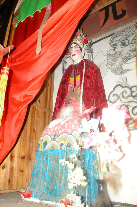Second wife of Great Lord of White Mountain on the left-hand side of the altar