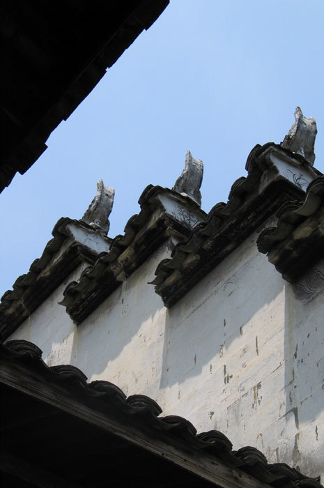 Painted designs on eaves Painted designs on eaves