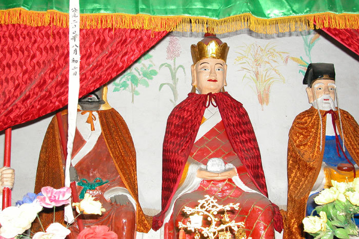 Kshitigarbha (center), Long-brow God (right), and Dharmamati (left) Kshitigarbha (center), Long-brow God (right), and Dharmamati (left)