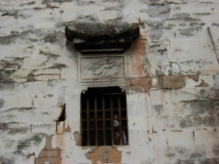 Window and a painting of birds with cherry blossom