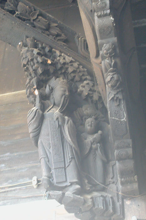 bracket with scholar and attendant