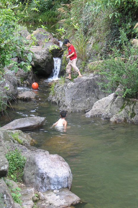 kids playing in the river