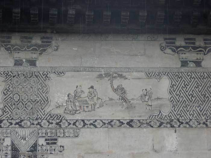 Painting on the near -right hand side of the front gate