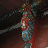 A bracket on the right-hand side decorated with a happy child and a unicorn