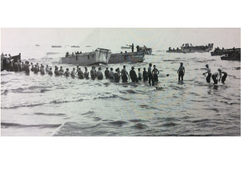 Men unloading onto Beach White 3.pdf