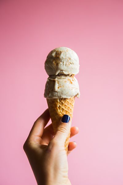 girl's hand holding an ice cream