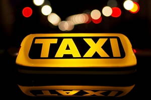 sign on top of a taxi