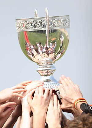 football team wining a trophy cup