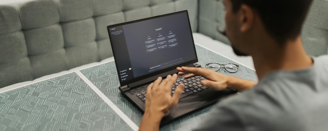 A professional using an AI automation platform to build workflows, exploring modern Zapier alternatives on a laptop.