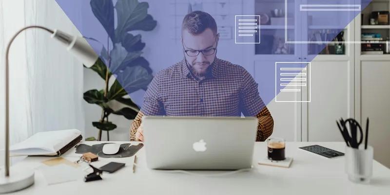 Man working on a laptop at desk with digital document graphics