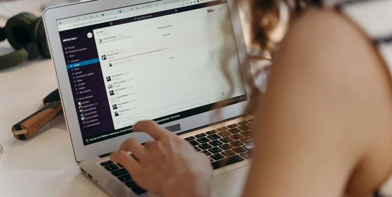 Person working on a laptop with email open