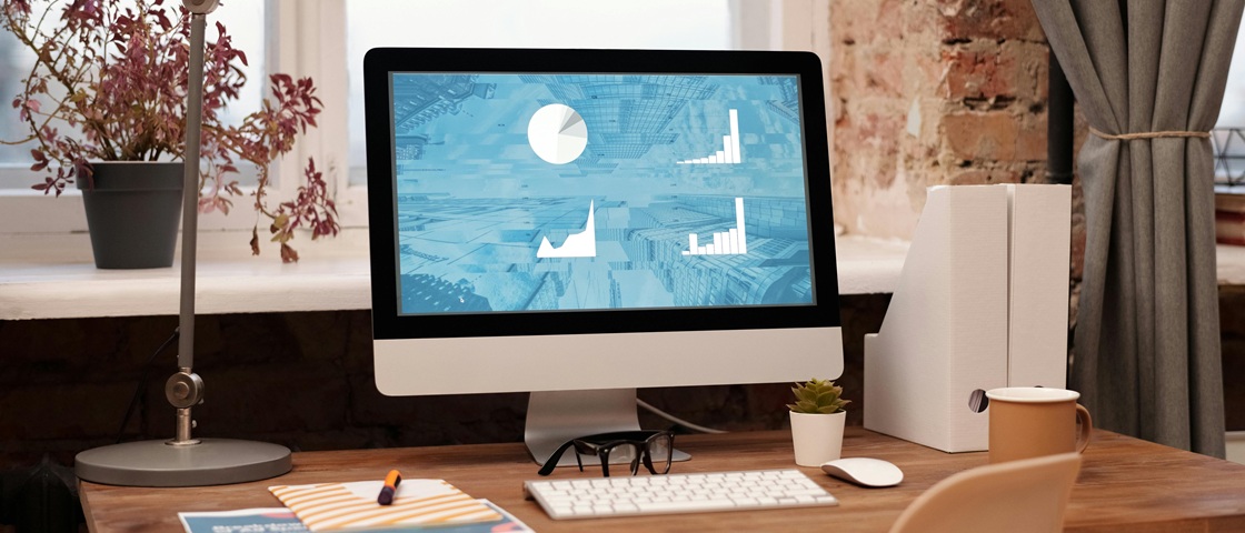 Desktop monitor displaying data visualization and analytics for scraping prices from websites