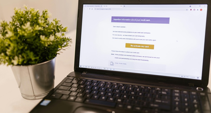 Laptop displaying a credit card security warning common alert sent by email automation