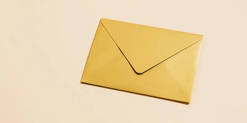 Gold envelope on a light background