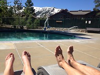 Pool, mountains, snow and sun