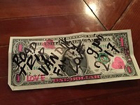 Ons beschreven  one dollar biljet wat we achterlaten