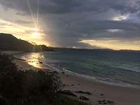 Zonsondergang op het strand van Byron Bay