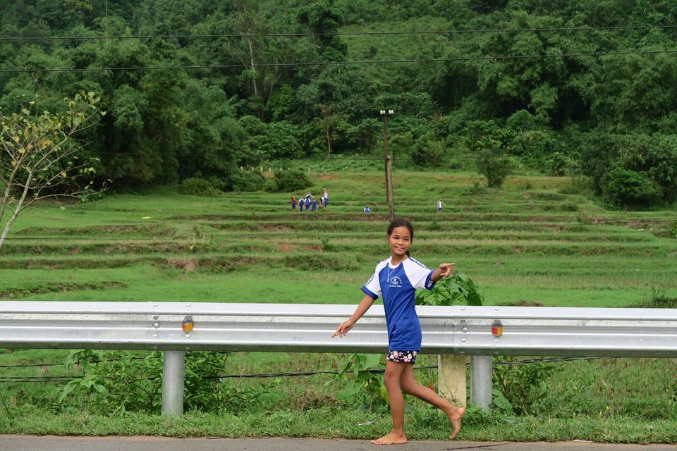 All the locals are waving and smiling!! They are even waving on the background!
