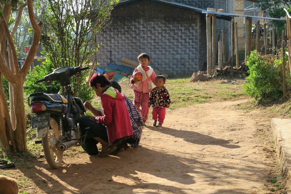 Curious kids watching while our chef was reparing the motorbike