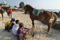 Some kids are trying to sell a horse ride