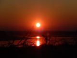 Zonsondergang bij de rivier